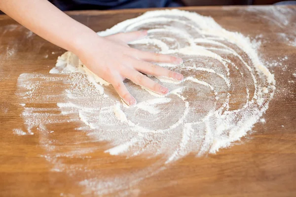 Child making pizza dough — Stock Photo