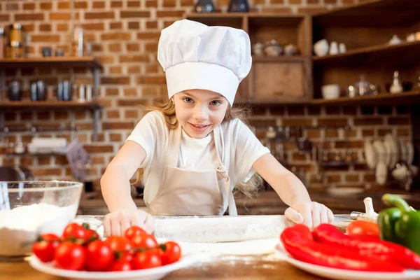 Girl making pizza dough — Stock Photo