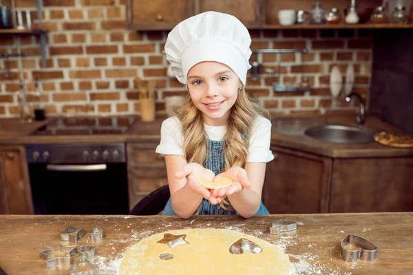 Girl holding raw dough — Stock Photo