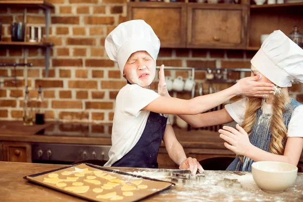 Children playing with flour — Stock Photo