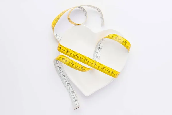 Measuring tape and plate — Stock Photo