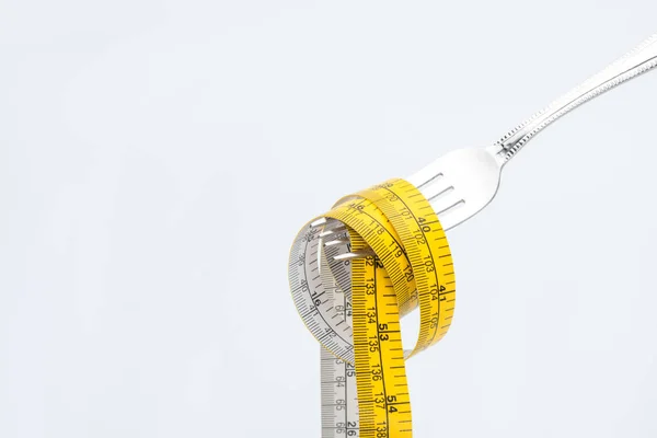 Measuring tape on fork — Stock Photo