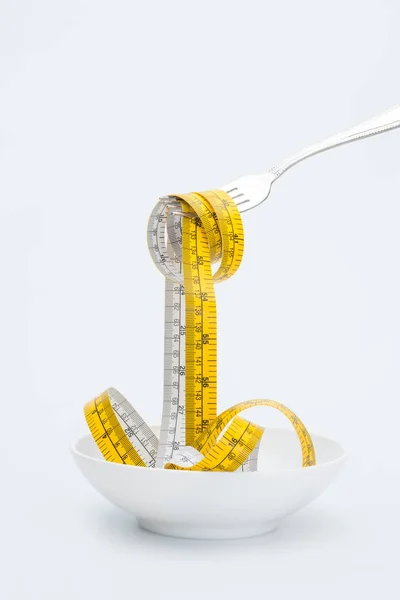 Measuring tape on fork — Stock Photo