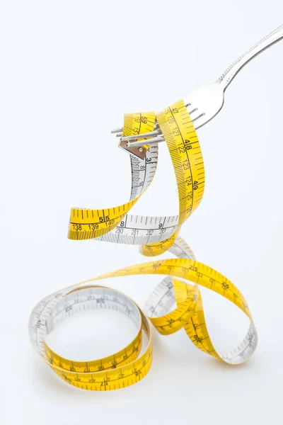 Measuring tape on fork — Stock Photo