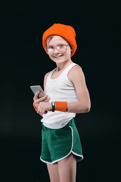 Sporty boy using smartphone — Stock Photo