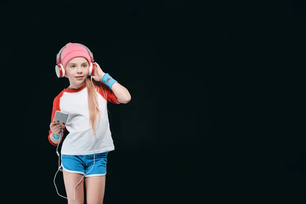 Спортивна дівчина в навушниках — стокове фото