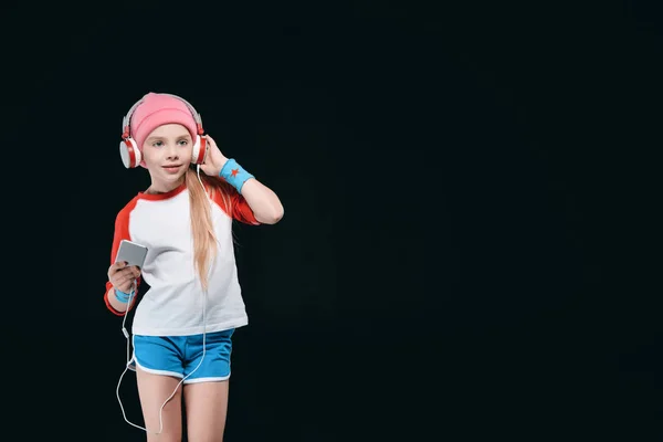 Sporty girl in headphones — Stock Photo