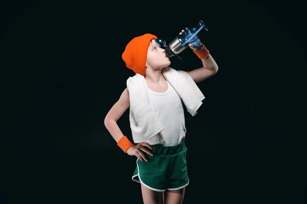 Sporty boy drinking water — Stock Photo