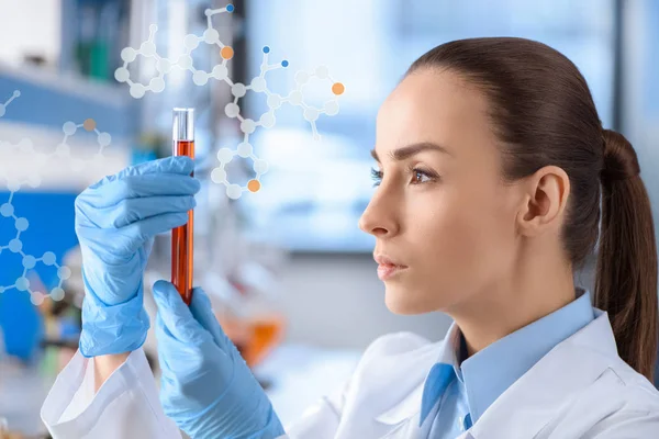 Chemist with test tube in hands — Stock Photo
