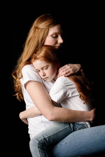 Mother hugging daughter — Stock Photo