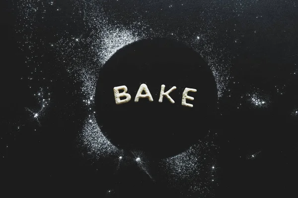 Cookies in forms of letters with powdered sugar — Stock Photo