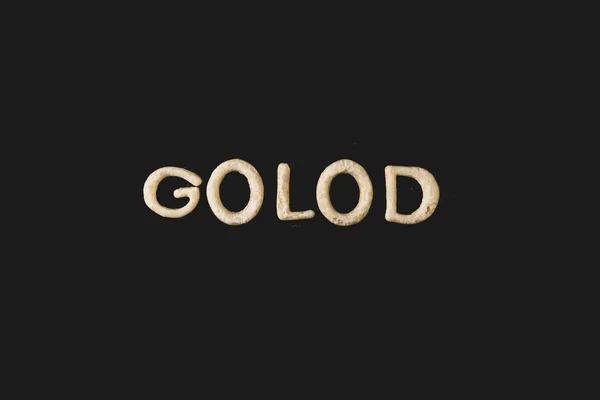 Word golod made from dough — Stock Photo