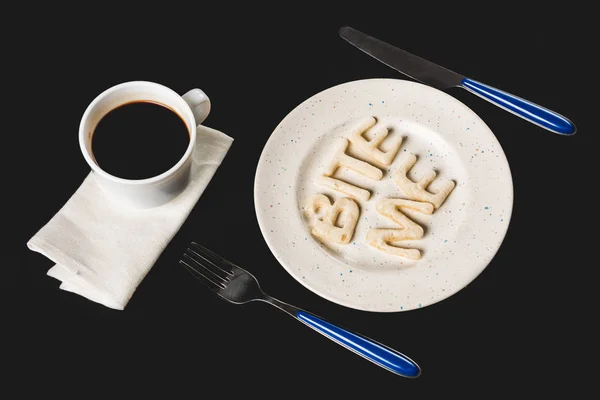 Lettering from dough on plate — Stock Photo