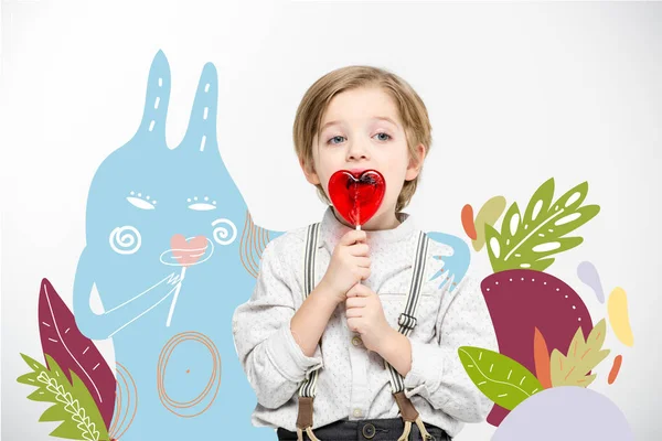 Lindo niño con piruleta - foto de stock