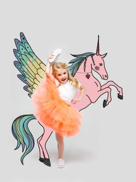 Girl with hand drawn colorful unicorn — Stock Photo