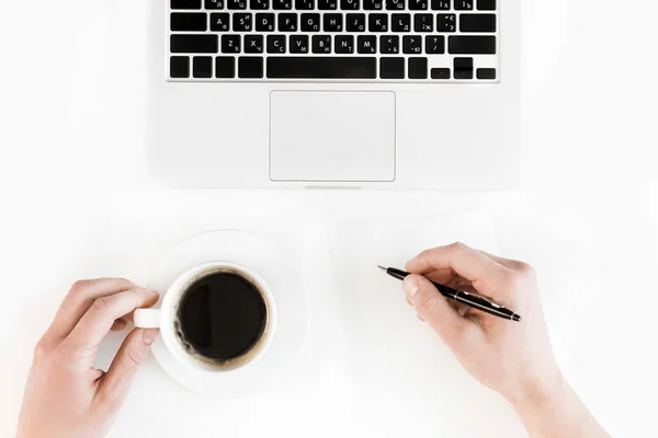 Laptop and person at workplace — Stock Photo