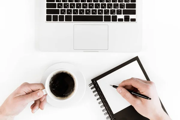 Laptop and person at workplace — Stock Photo