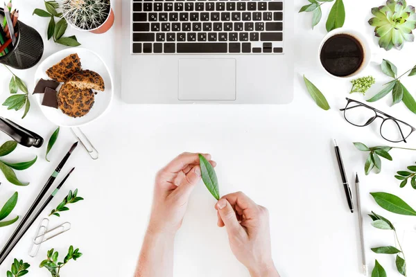 Laptop and person at workplace — Stock Photo