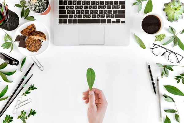 Laptop and person at workplace — Stock Photo