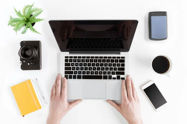 Hands holding laptop — Stock Photo