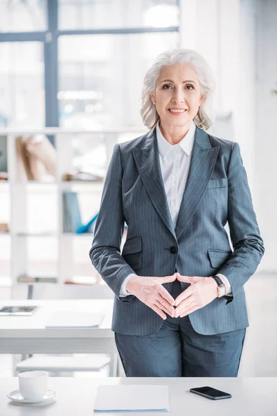 Senior businesswoman at workplace — Stock Photo