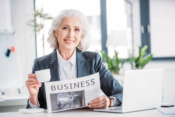 Senior businesswoman at workplace — Stock Photo