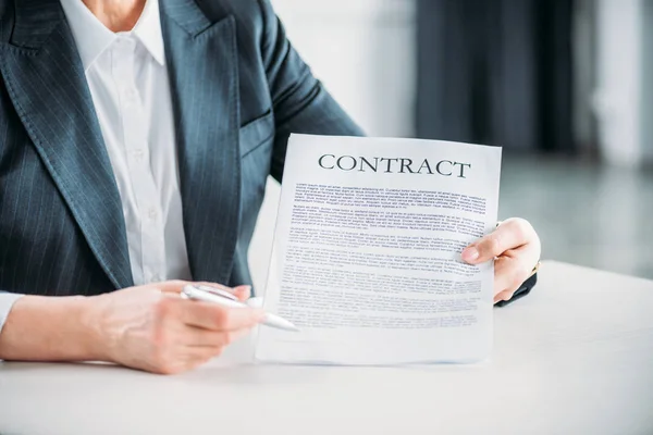 Businesswoman pointing at contract — Stock Photo
