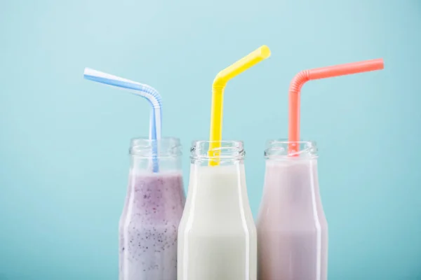 Tasty milkshakes in glass bottles — Stock Photo