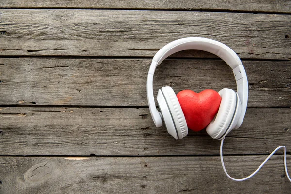 Headphones with red heart sign — Stock Photo
