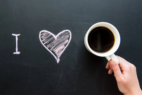 Heart doodle and cup of coffee — Stock Photo