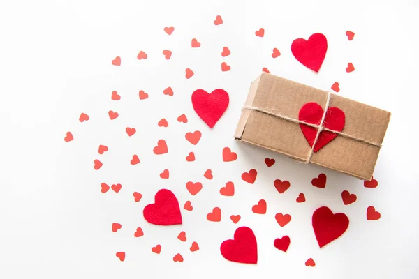 Gift box with red hearts — Stock Photo
