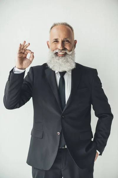 Businessman showing okay sign — Stock Photo