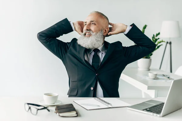 Relaxed senior businessman — Stock Photo