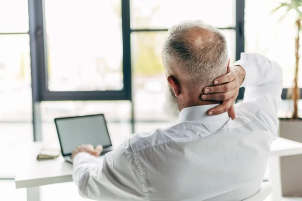 Businessman with pain in neck — Stock Photo