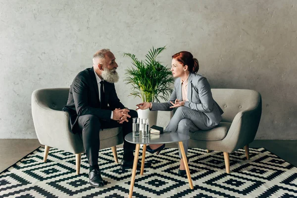 Business partners conversing in office — Stock Photo