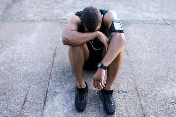 African american sportsman in earphones — Stock Photo