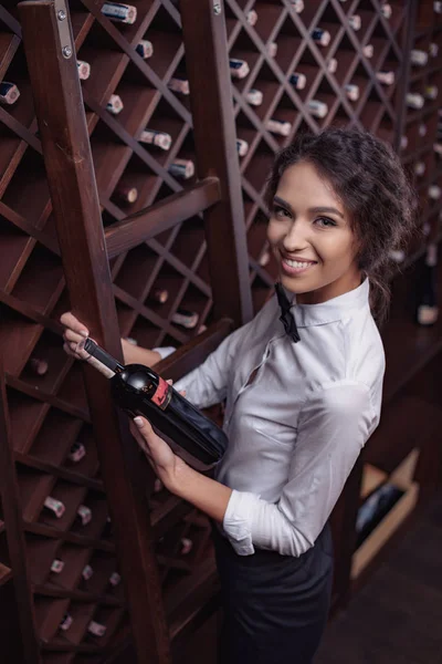 Sommelier in wine cellar — Stock Photo
