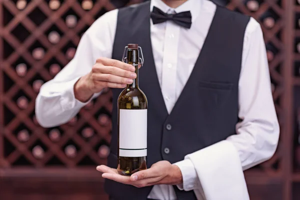 Sommelier with bottle of wine — Stock Photo