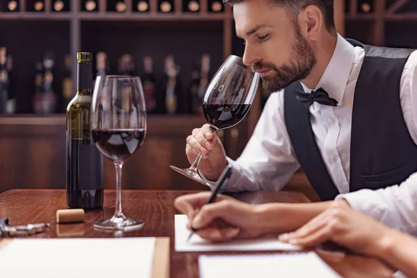 Sommeliers tasting wine in cellar — Stock Photo