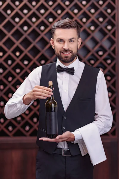 Sommelier with bottle of wine — Stock Photo