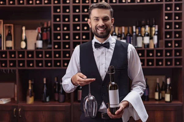 Sommelier with wine and glass — Stock Photo