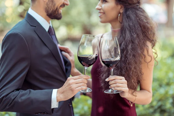 Coupe with red wine in garden — Stock Photo