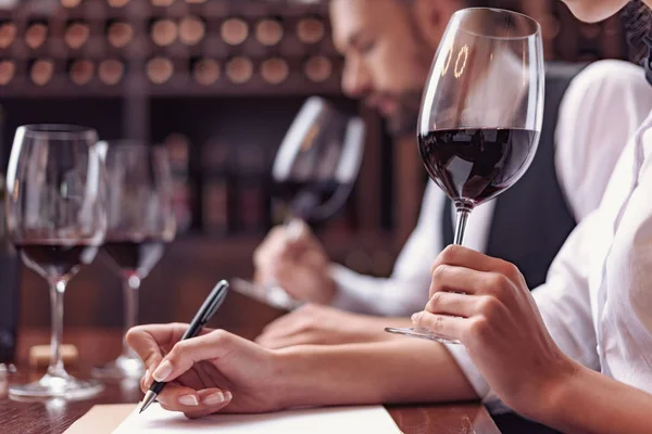 Sommeliers tasting wine in cellar — Stock Photo