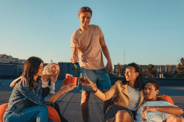 Friends having party on roof — Stock Photo