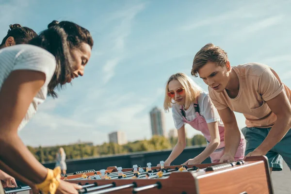 Friends playing table football — Stock Photo