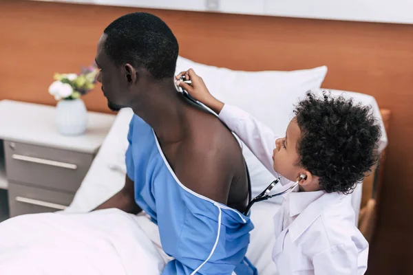 African american child checking patient — Stock Photo