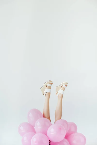 Female legs and balloons — Stock Photo