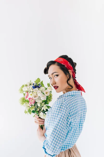 Sensual asian woman with bouquet of flowers — Stock Photo