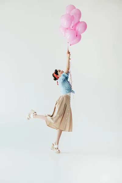 Азиатка с воздушными шарами — стоковое фото