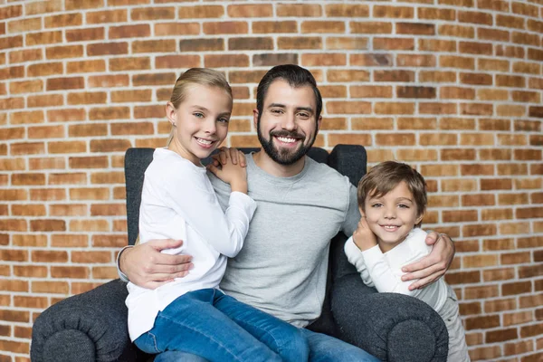 Cheerful siblings and father — Stock Photo